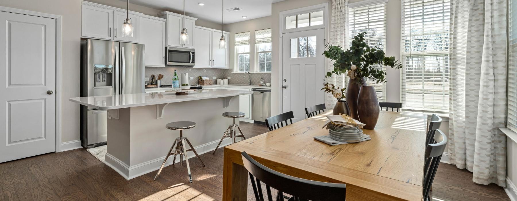 a kitchen with a dining table