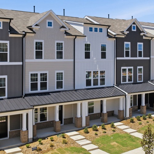 row of townhomes with front lawns