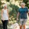 a man and woman walking a dog