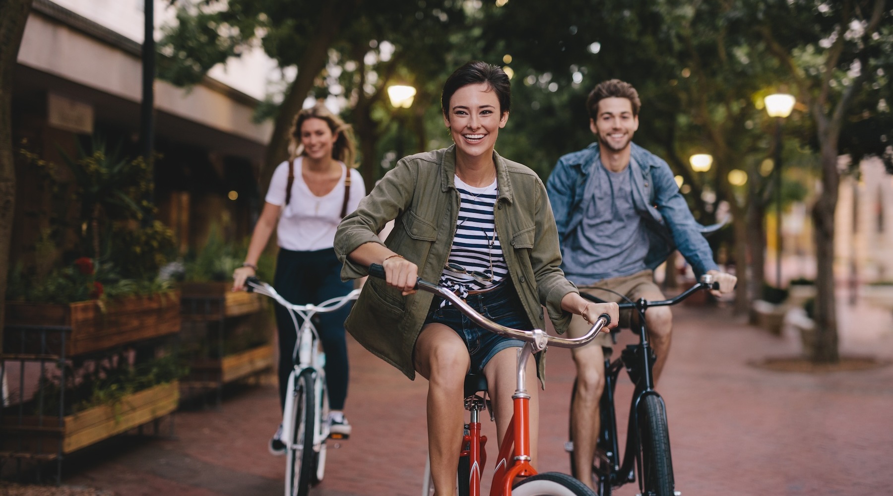 three girls riding their bicycles
