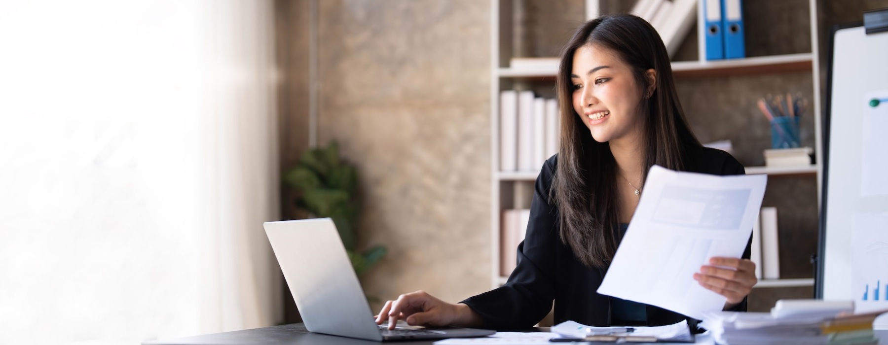 a woman working at a laptop