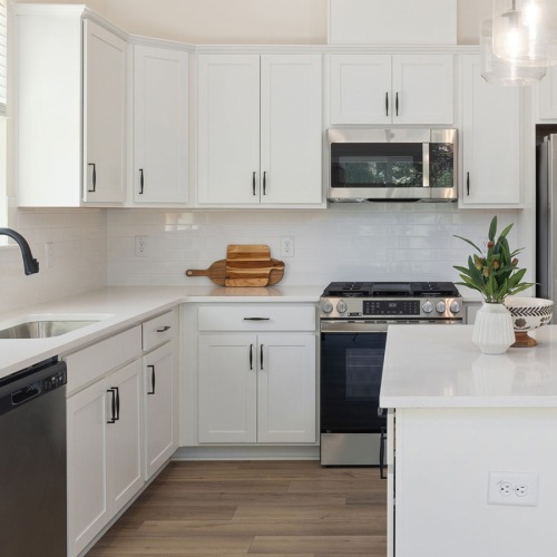 kitchen with large island and white cabinets