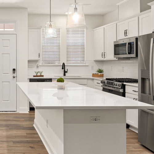 kitchen with white cabinets and island