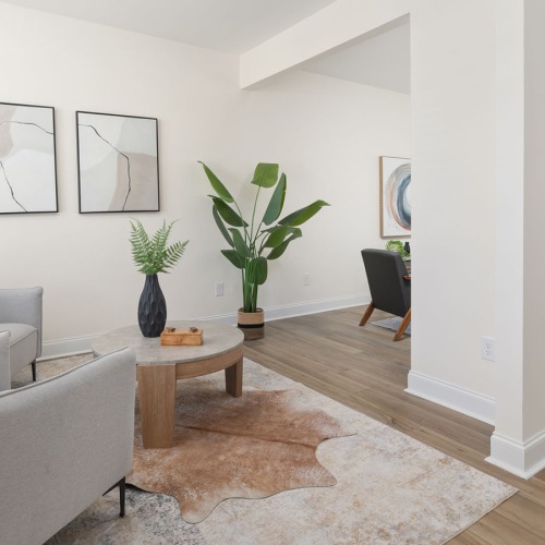 living room with chairs and coffee table