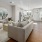 a large living room with a large mirror